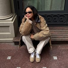 Aimee Song wearing suede sneakers