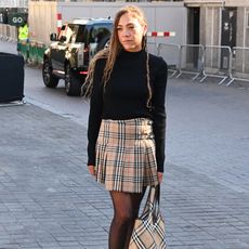 Miquita Oliver in Burberry check pleated skirt