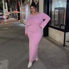 gia wears pink dress on sidewalk at night