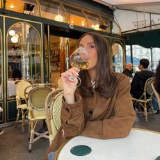 Emma Leger in a brown suede jacket