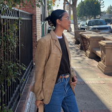 Stephanie Arant in a suede jacket, sweater, and jeans.